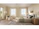 Bright bedroom with large windows, plush bedding, and ample natural light at 284 Meeting St # 301, Charleston, SC 29401