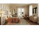 Main bedroom with private balcony access and stylish furnishings at 284 Meeting St # 301, Charleston, SC 29401