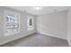 Bedroom with two windows, grey carpet, and neutral walls at 714 Maynard Ln, Summerville, SC 29486