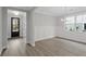 Bright dining room features hardwood floors and wainscoting at 714 Maynard Ln, Summerville, SC 29486