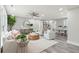 Spacious living room with light-colored furniture and large windows at 1555 Scott Hill Rd, Charleston, SC 29412