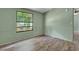 Bedroom with wood-look flooring and a window providing natural light at 137 Thelma Dr, Summerville, SC 29485