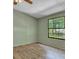 Bedroom featuring wood-look floors, a window, and a ceiling fan at 137 Thelma Dr, Summerville, SC 29485