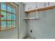 Simple laundry room with shelving and window at 137 Thelma Dr, Summerville, SC 29485