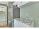 Kitchen boasts granite countertops and stainless steel refrigerator at 137 Thelma Dr, Summerville, SC 29485