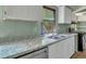 Updated kitchen with granite countertops and white cabinets at 137 Thelma Dr, Summerville, SC 29485