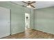 Bedroom offering wood-look flooring, a ceiling fan, and bathroom access at 137 Thelma Dr, Summerville, SC 29485