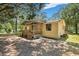 Yellow single-wide mobile home with front porch and large yard at 137 Thelma Dr, Summerville, SC 29485