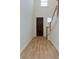 Hardwood floor entryway with stairs and a dark brown front door at 427 Grove End Rd, Moncks Corner, SC 29461