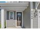 Gray house with white accents, black front door, and landscaped yard at 427 Grove End Rd, Moncks Corner, SC 29461