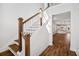 Elegant staircase with wooden railings and hardwood floors at 427 Grove End Rd, Moncks Corner, SC 29461