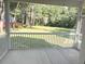 Spacious screened porch with a view of the wooded area at 102 Whitesville Rd, Moncks Corner, SC 29461