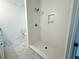 Modern bathroom with white subway tile shower and marble-look floors at 102 Whitesville Rd, Moncks Corner, SC 29461