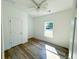 Bright bedroom with wood-look floors and a window overlooking the yard at 102 Whitesville Rd, Moncks Corner, SC 29461