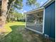 Screened porch with ceiling fan, overlooking the backyard at 102 Whitesville Rd, Moncks Corner, SC 29461