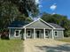 Newly built gray house with a sandy driveway at 102 Whitesville Rd, Moncks Corner, SC 29461