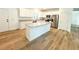Modern kitchen with white cabinets, granite counters, and island at 102 Whitesville Rd, Moncks Corner, SC 29461