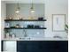 Modern wet bar with gray tile backsplash, floating shelves, and a farmhouse sink at 412 Oak Hammock Ct # 53, Johns Island, SC 29455