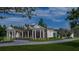 Two-story home exterior with front porch and landscaping at 210 Oyster Catcher Ln, Ravenel, SC 29470