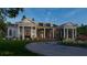 House exterior at night with landscaping and driveway at 210 Oyster Catcher Ln, Ravenel, SC 29470