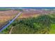 Aerial view of waterfront property with marsh and a tranquil waterway at 210 Oyster Catcher Ln, Ravenel, SC 29470