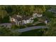 Aerial view of a beautiful house, guest house, and landscaping at 210 Oyster Catcher Ln, Ravenel, SC 29470