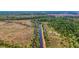 High-angle view of a property with water access and marshland at 210 Oyster Catcher Ln, Ravenel, SC 29470