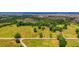 Aerial view of expansive property with lush green pastures and mature trees at 210 Oyster Catcher Ln, Ravenel, SC 29470