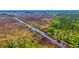 Aerial view of waterfront property with marsh and a tranquil waterway at 210 Oyster Catcher Ln, Ravenel, SC 29470