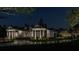 House exterior at night with landscaping and driveway at 210 Oyster Catcher Ln, Ravenel, SC 29470