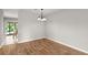 Simple dining area with hardwood floors and a light fixture at 107 Darcy Avenue, Goose Creek, SC 29445