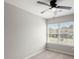 Bright bedroom featuring a ceiling fan and large window at 107 Darcy Avenue, Goose Creek, SC 29445