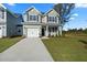 Two-story house with gray siding and a white garage door at 426 Grove End Rd, Moncks Corner, SC 29461