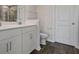 Clean bathroom with white cabinets and gray vinyl flooring at 426 Grove End Rd, Moncks Corner, SC 29461