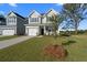 Two story house with gray siding and a landscaped yard at 426 Grove End Rd, Moncks Corner, SC 29461