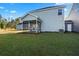 House with screened porch and grassy backyard at 426 Grove End Rd, Moncks Corner, SC 29461