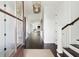 Bright and spacious entryway with dark hardwood floors and shiplap walls at 1602 Bernier Commons, Johns Island, SC 29455