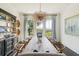 Bright dining room with a rustic table and built-in hutch at 1602 Bernier Commons, Johns Island, SC 29455