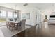 Elegant dining room with a rustic wooden table and water views at 1602 Bernier Commons, Johns Island, SC 29455