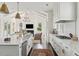 Open concept kitchen with white cabinets and a view at 1602 Bernier Commons, Johns Island, SC 29455