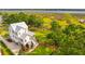 Elevated view of a white house with a metal roof and marsh views at 1602 Bernier Commons, Johns Island, SC 29455