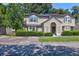 Two-story tan house with green shutters and landscaping at 1120 Monaco Dr, Mount Pleasant, SC 29464