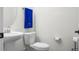 Small bathroom with white pedestal sink and toilet at 386 Tupelo Lake Dr, Summerville, SC 29486