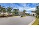 Gated community entrance with landscaped grounds and guardhouse at 386 Tupelo Lake Dr, Summerville, SC 29486