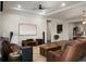 Living room with leather sofas, hardwood floors, large TV and home theater system at 386 Tupelo Lake Dr, Summerville, SC 29486