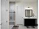 Modern bathroom with a large glass shower, double vanity, and black cabinets at 386 Tupelo Lake Dr, Summerville, SC 29486