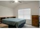 Cozy bedroom with a dresser and large window with blinds at 386 Tupelo Lake Dr, Summerville, SC 29486
