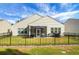 Home's backyard with fenced area, patio, and screened porch at 386 Tupelo Lake Dr, Summerville, SC 29486