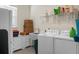 Bright laundry room with washer, dryer, and ample storage at 386 Tupelo Lake Dr, Summerville, SC 29486