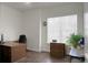 Bright home office features wood floors, built-in shelving and a large window at 386 Tupelo Lake Dr, Summerville, SC 29486